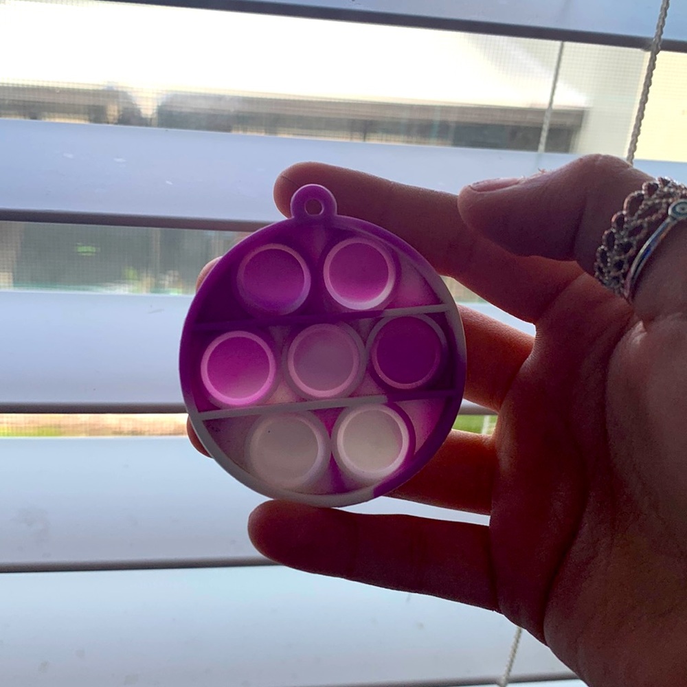 Cute little purple and white pop it fidget toy